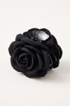 Black fabric flower claw clip for girls – three-quarter view from above
