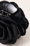 Black flower claw clip for girls – close-up of the spring and the fabric texture of the petals